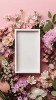Floral Arrangement With a Blank Frame on a Pink Background for Decoration and Display photo