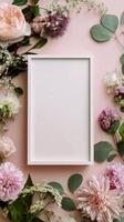 Floral Arrangement With a Blank Frame on a Pink Background for Decoration and Display. photo