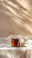 Natural Skincare Product Placed Elegantly on Neutral Fabric With Dried Plants in the Background. photo