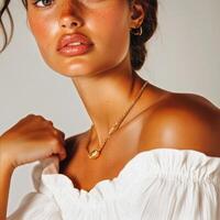 Model Showcases Elegant Jewelry in Studio Setting With Natural Lighting During a Fashion Photoshoot photo