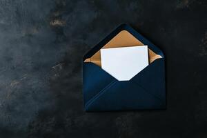 Elegant Navy Envelope With Blank Card on a Black Surface. photo
