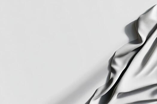 Soft White Fabric Drapes Elegantly Across a Smooth Surface in a Well-Lit Room photo