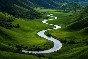 Scenic View of a Winding River Through Lush Green Valley in a Mountainous Landscape at Sunset. photo
