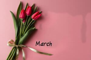 Colorful Bouquet of Tulips With Pink Background Celebrating the Arrival of March. photo