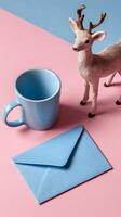 Cozy Coffee Moment With a Blue Envelope and Decorative Deer Figurine on Soft Pink Table. photo