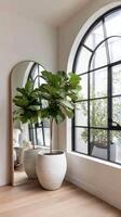 Bright Interior With a Fiddle Leaf Fig Plant Beside a Large Mirror Near an Elegant Window. photo