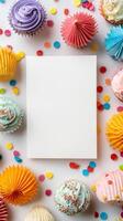 Colorful Cupcakes Arranged Around a Blank Card for a Festive Celebration. photo