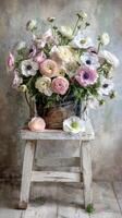 Beautiful Bouquet of Ranunculus Flowers on a Rustic Chair in Soft Pastel Shades. photo