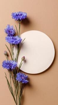 Beautiful Blue Flowers and Circular Paper on a Brown Background for Artistic Display. photo
