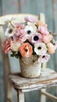 Beautiful Arrangement of Pastel Flowers in a Rustic Pot on a Vintage Chair photo