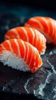 Delicious Salmon Nigiri Served on a Dark Stone Plate With Vibrant Colors and Textures photo