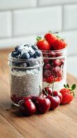 Fresh Fruit and Chia Seed Parfaits Arranged in Jars on a Wooden Table photo