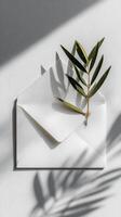 Creative Envelope With Greenery Against Textured Wall Showcasing Modern Design. photo