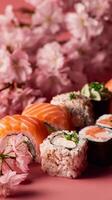 Colorful Sushi Platter Arranged With Pink Cherry Blossoms on a Vibrant Background photo