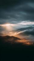 Stunning View of Mountain Range Above Clouds at Sunrise With Soft Light Illuminating the Landscape. photo