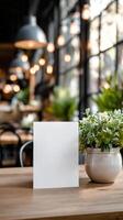 Cozy Cafe Interior With Plants and Blank Menu on Wooden Table photo
