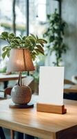 Modern Cafe Setting With Minimalistic Decor and Warm Lighting Featuring Potted Plants. photo