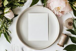 Elegant Blank Canvas Surrounded by Fresh Flowers and Sewing Supplies on a Rustic Table. photo