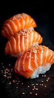 Delicious Salmon Nigiri Served on a Dark Stone Plate With Vibrant Colors and Textures. photo