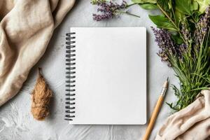 Blank Notebook With Pencil and Fresh Herbs on Textured Surface in a Bright Natural Setting photo