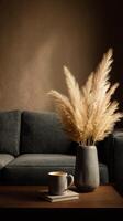 Modern Living Room With Cozy Couch and Decorative Vase of Dried Plants in Afternoon Light. photo