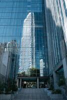 Reflection of Modern Skyscrapers in Glass Buildings During Daylight in an Urban Area. photo
