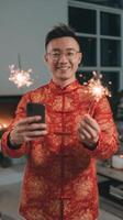 Celebratory Moment With Sparklers in a Cozy Living Room During a Festive Gathering. photo