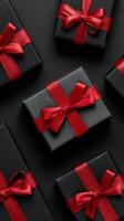 Elegant Black and Red Gift Boxes Arranged Neatly on Dark Surface for Special Occasion. photo