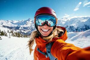 Smiling Skier Takes Selfie Against Stunning Mountain Backdrop in Winter Sunshine photo