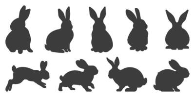 Set of bunny rabbit silhouettes in different poses, sitting, running and jumping isolated on transparent background vector
