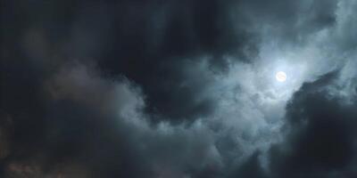 a full moon is seen through the clouds photo