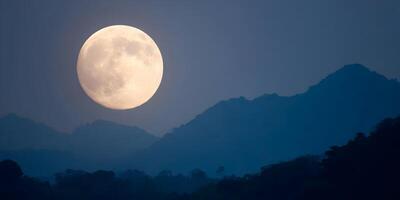 Large Full Moon over Silhouetted Mountains and Forest Night Sky Scene photo