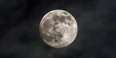 the moon is shown in the dark sky photo