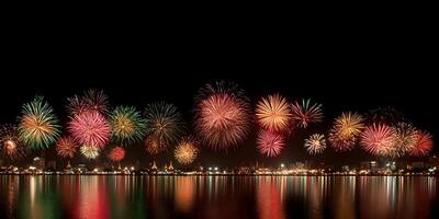 fireworks over the water with a city skyline in the background photo