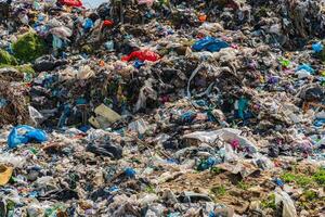 Pile of domestic garbage in landfill dump site. Global environmental issue of waste disposal photo