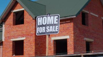 Home For Sale sign inscription note tag message on paper. Real-estate, buy and sell cheap house property, moving sign with house on background. Copy-space. Advertising. Selling apartment. No people video