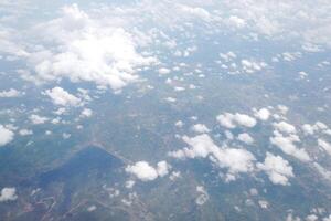 Aerial view of lush green landscape with clouds above rural area nature photography sky environment wide angle serenity photo