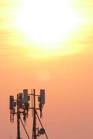 Telecommunication tower at sunset urban landscape photograph evening sky silhouette technology impact photo