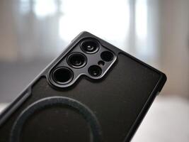 Smartphone camera close-up indoor setting product photography modern environment macro view technology showcase photo