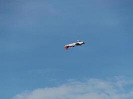 Aircraft in flight open sky aerial photography blue atmosphere high angle aviation dynamics photo