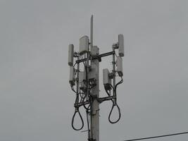 Telecommunication infrastructure installation urban setting technology structure cloudy atmosphere elevated perspective connectivity concept photo