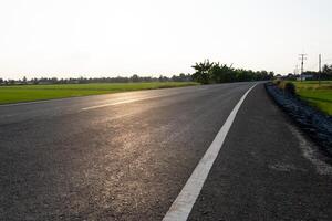Scenic road journey rural landscape photography sunlit fields side view serene travel experience photo