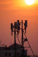 Telecommunication towers sunset urban environment photography evening viewpoint technology concept photo