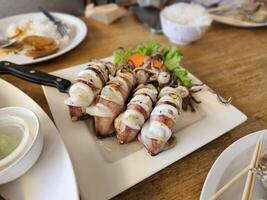 Grilled squid dish local seafood restaurant food photography casual dining close-up view culinary delight photo