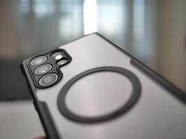 Close-up shot of a smartphone indoor setting product photography modern environment focused viewpoint technology concept photo