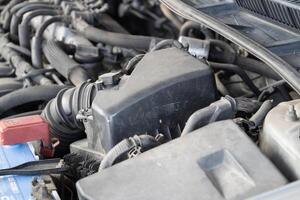 Engine maintenance process automotive workshop technical guide indoor environment close-up view mechanical insights photo