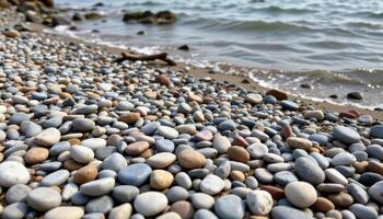 a rocky beach littered with smooth stones and driftwoods photo
