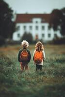 Children Explore a Field Near an Old Mansion on a Cloudy Day in Autumn photo