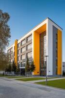 Modern Building With Striking Yellow Accents in a Landscaped Area During Daytime photo