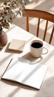 Cozy Workspace With Coffee and Open Notebook on a Wooden Table in Natural Light. photo